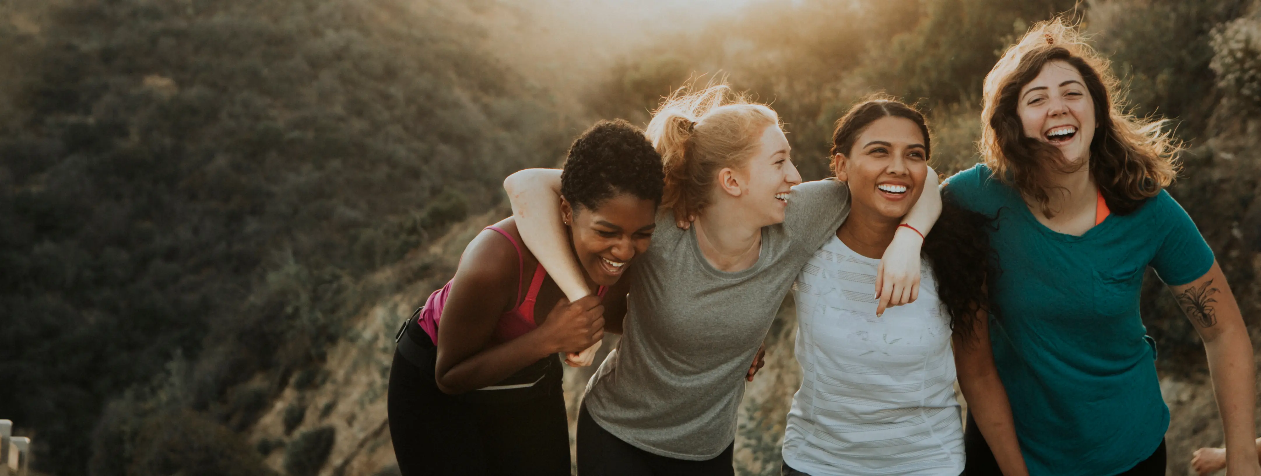 Friends hiking through hills